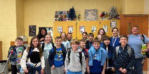 Image showing fifth grade students with their teacher and volunteer donning blue in support of World Diabetes Day which recognize all of the people living with the different types of diabetes