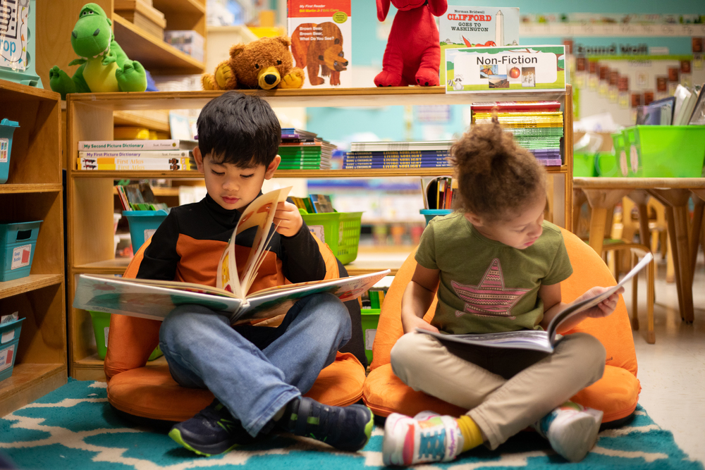two elementary students reading 5