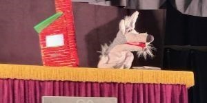 image of wolf puppet with house
