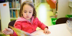 student reading a board book