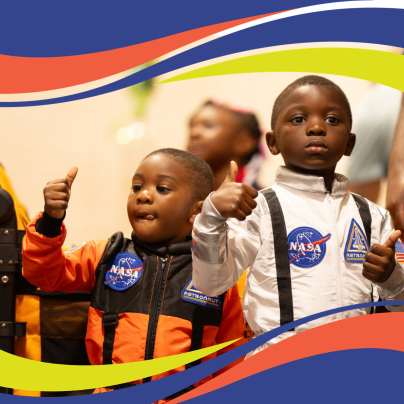 image of 2 students in NASA suits
