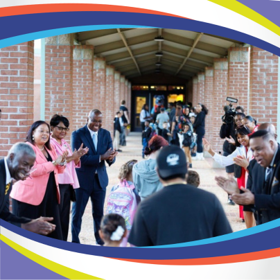 Dr. Bracy and others Welcome students Back to School