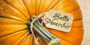 image of Hello November words on tag tied to pumpkin