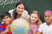 teacher and students around a globe