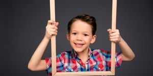 Boy holding a picture frame