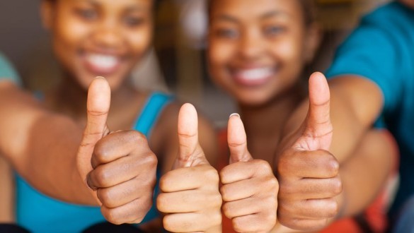 Students giving a thumbs up