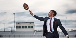 young man tossing the football 