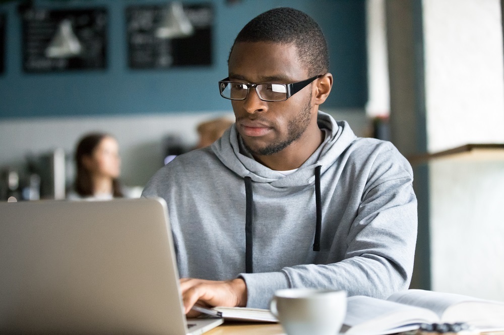 Man with a laptop at a table