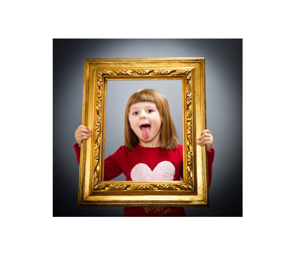 girl holding  empty gold frame