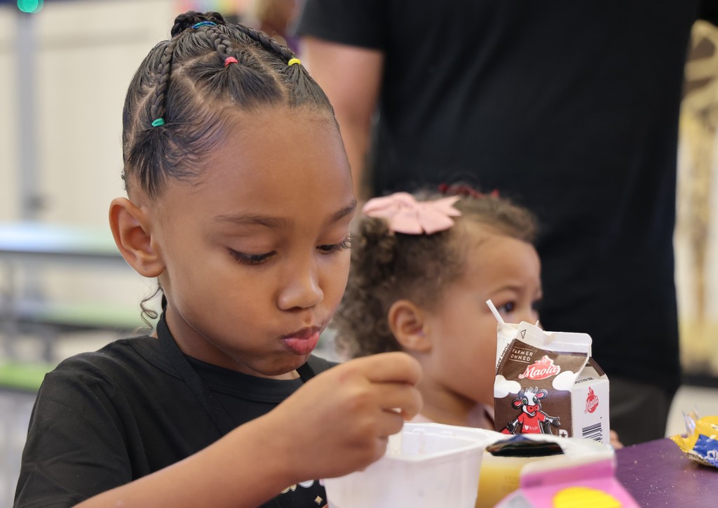 child eating in cafeteria