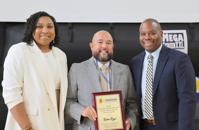 L-R: Dr. Queesha Tillman, Ruben Reyes and Dr. Eric Bracy after Reyes was named the 2025-2026 Dr. Joseph Locklear/Ricky Lopes Central Services Employee of the Year.