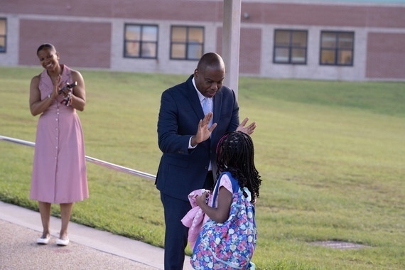 Dr. Bracy Greets a Student