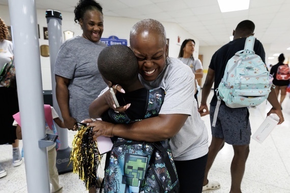 Student Getting a Hug from a Staff Member