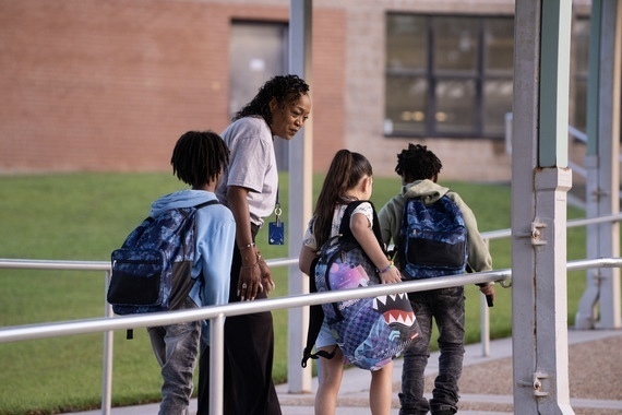 Staff Walking with Students to Class