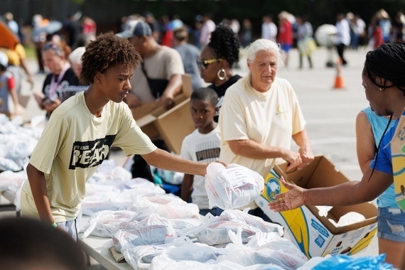 student volunteer at community event