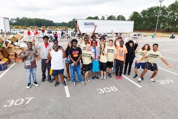 students at community event