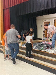 image of students selecting shoes