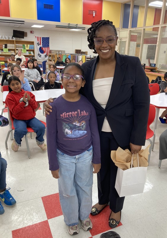 student and adult standing