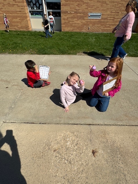 The students are showing the egg they found.