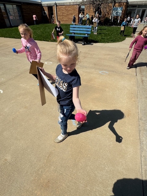 The students are showing the egg they found.