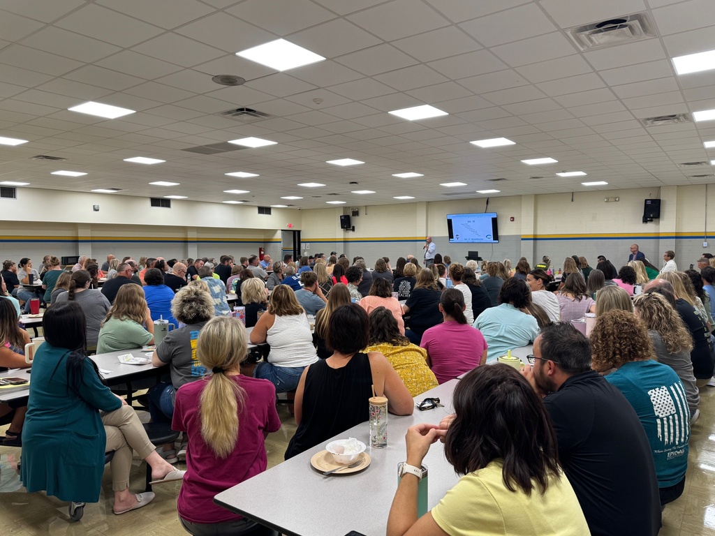 Staff is listening to Mr. Houchin's speech.