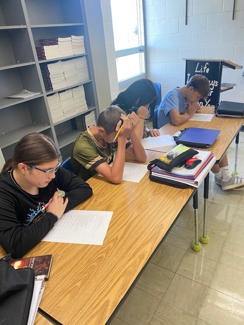 Students are figuring out the logic puzzle. 