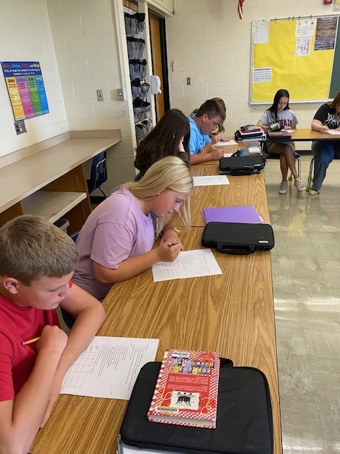 Students are figuring out the logic puzzle. 