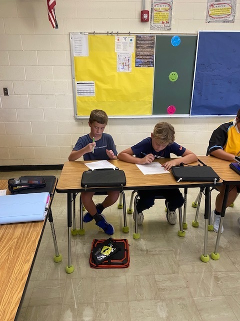 Students are figuring out the logic puzzle. 