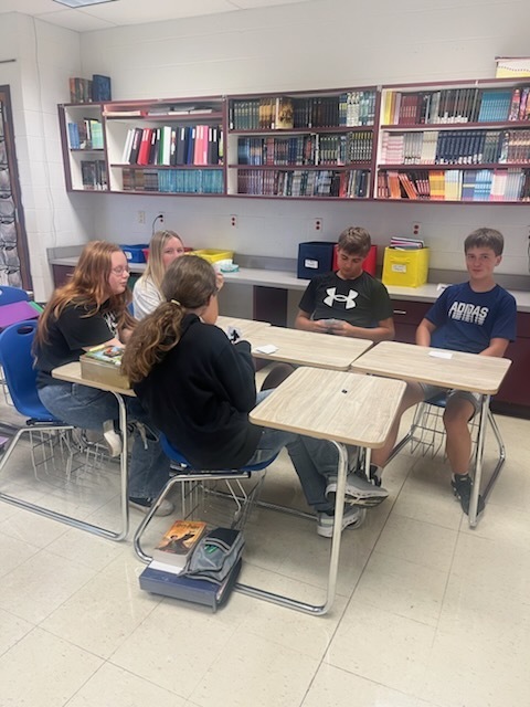Students are playing Go Fish only using ASL nonverbal gestures. 