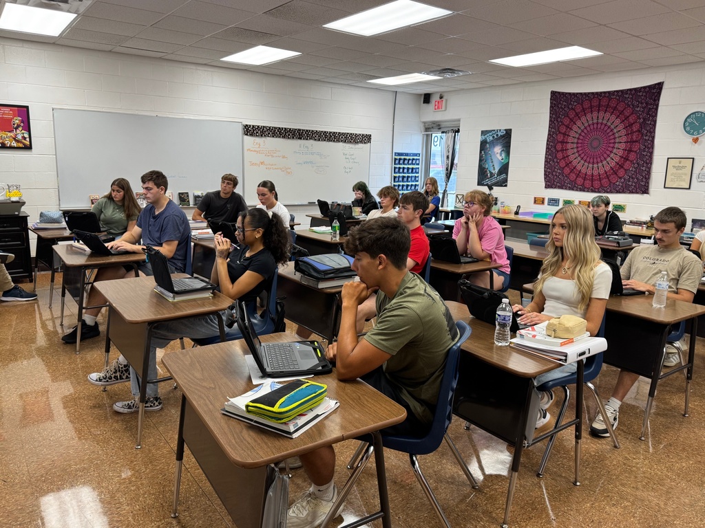 The students are following along with Mr. Cougill. 