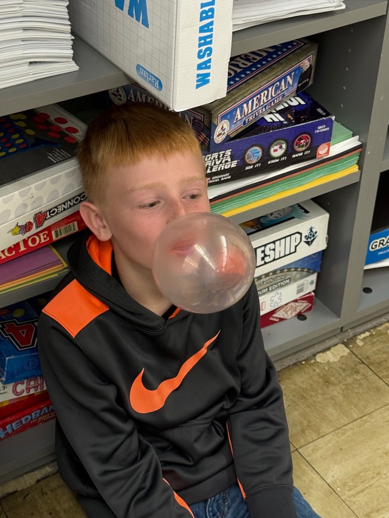 Students are blowing bubbles and measuring their size. 