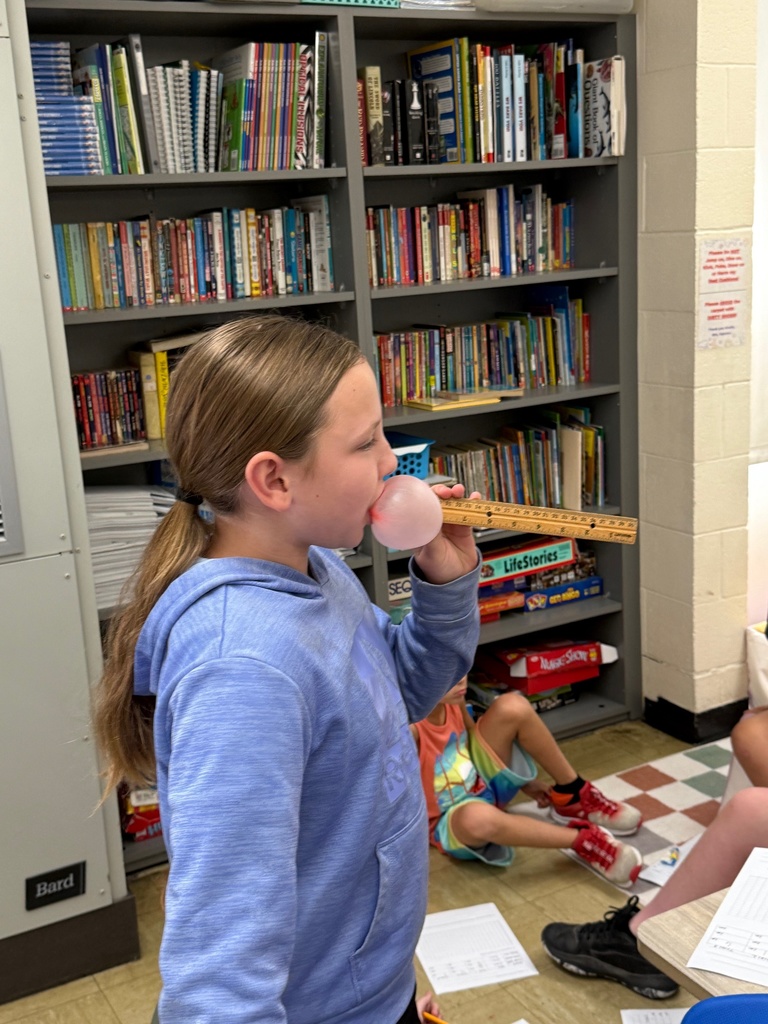Students are blowing bubbles and measuring their size. 