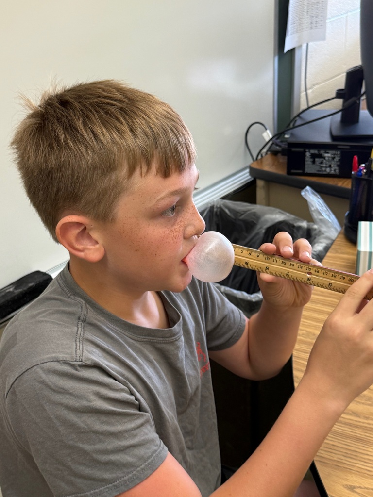 Students are blowing bubbles and measuring their size. 