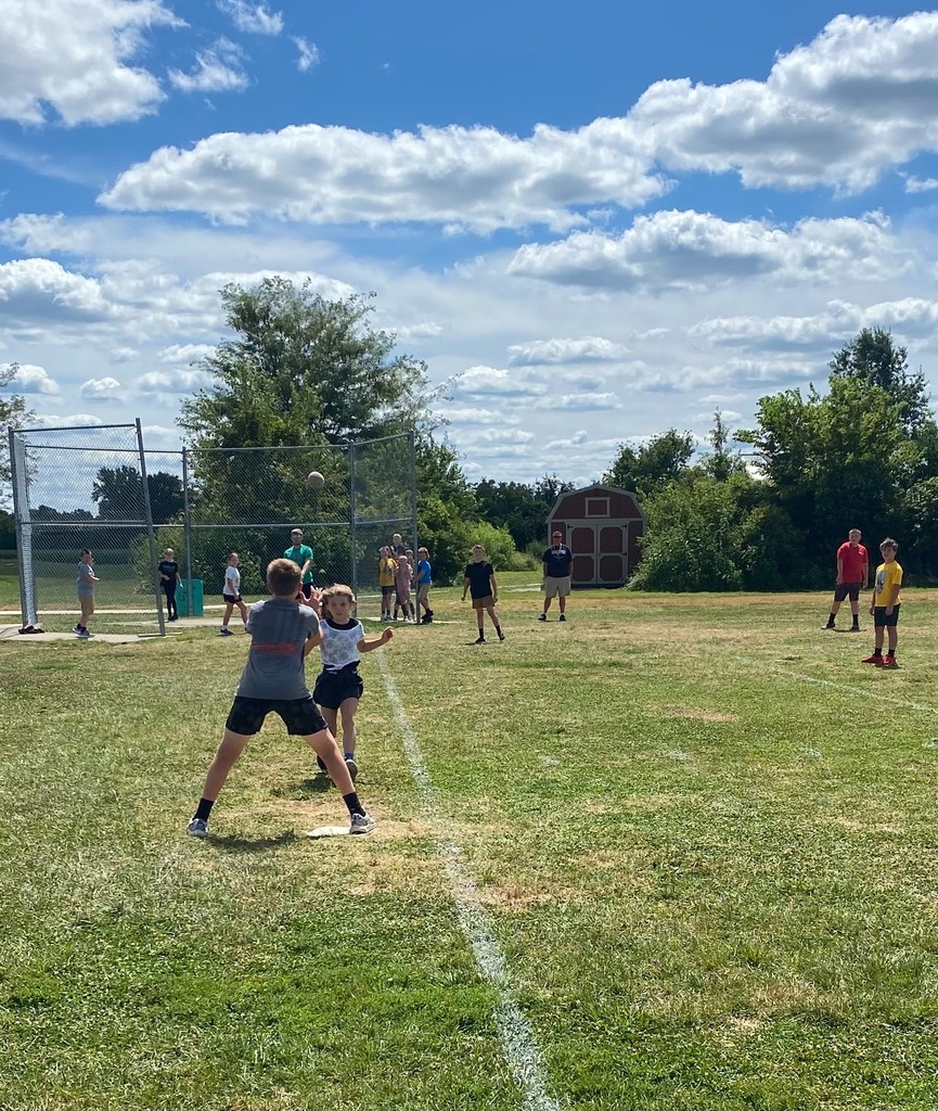 Middle school students are playing slow pitch softball.