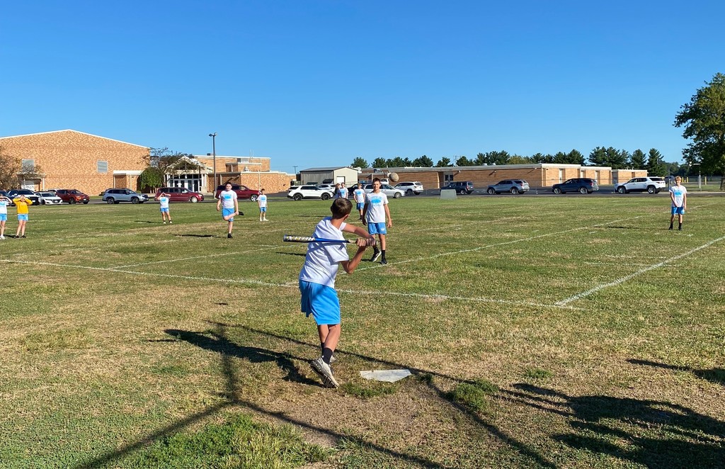 Middle school students are playing slow pitch softball.