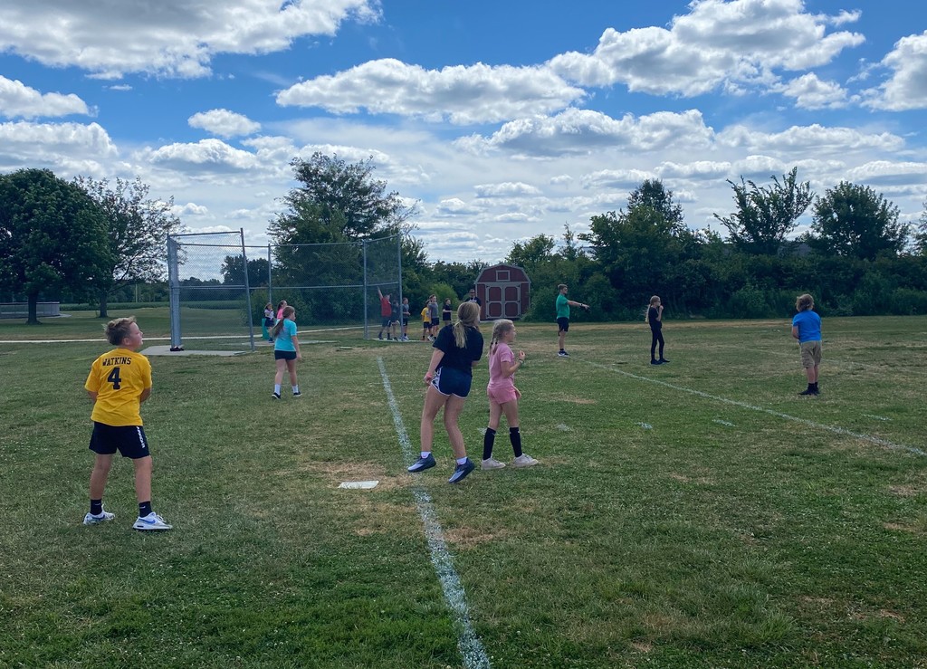Middle school students are playing slow pitch softball.
