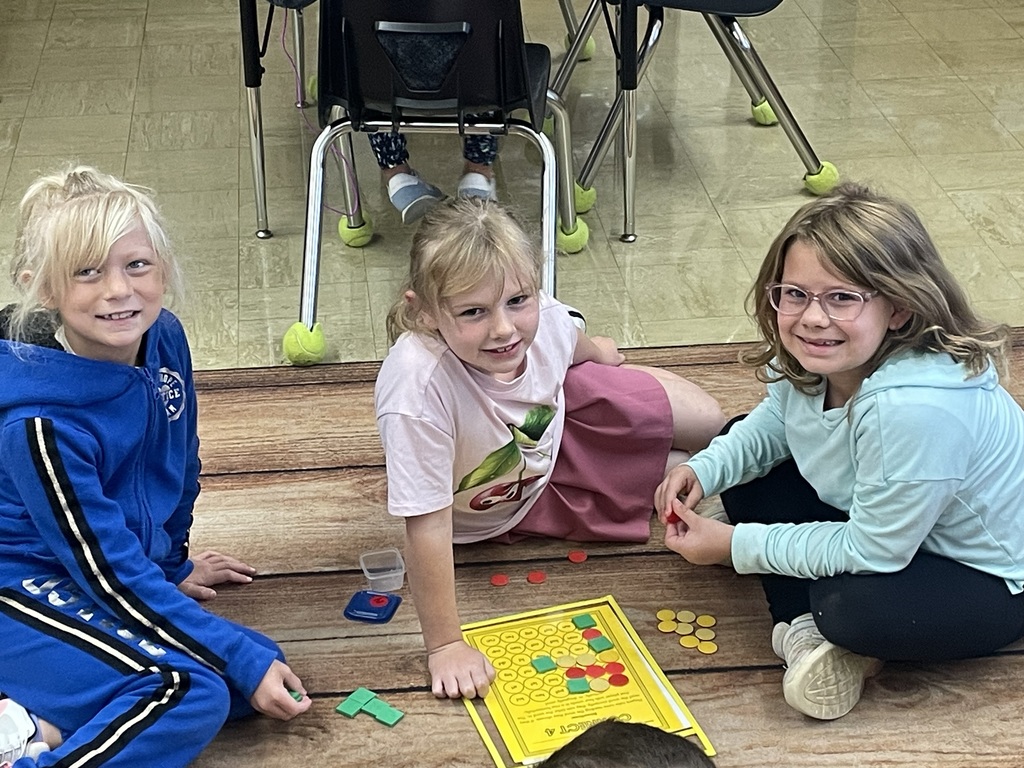 Three students are playing a game. 