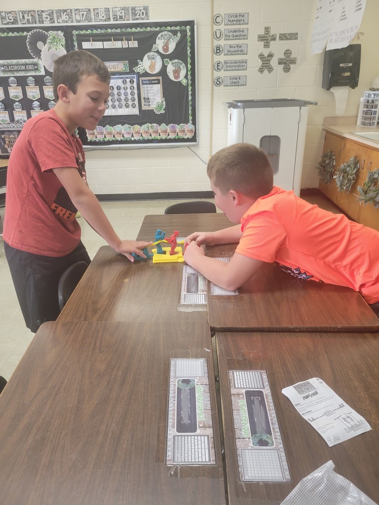 Students play a game. 