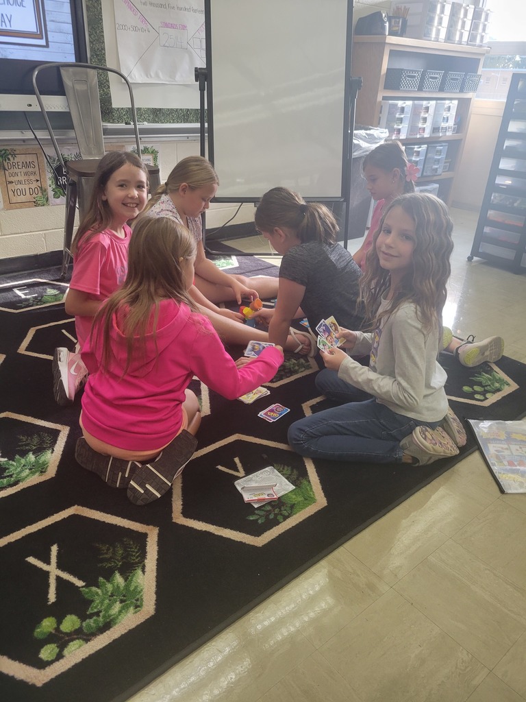 Students play a game. 