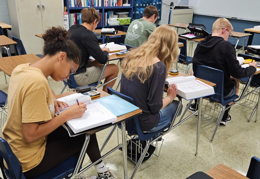 Ms. Booth's class is exploring limits analytically.