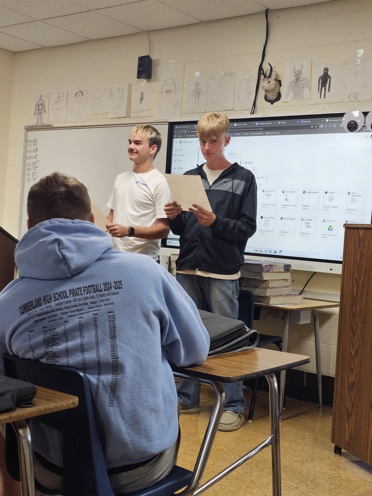 Two students are presenting to the class. 