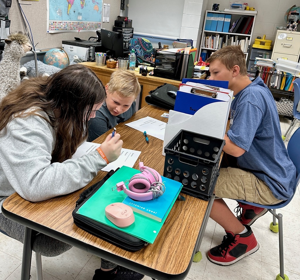 The students are preparing an experiment to find the best paper towel. 
