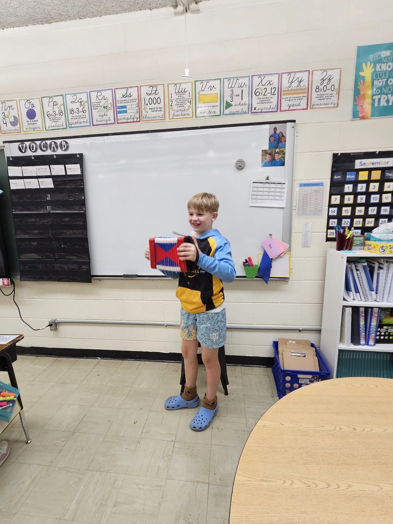 A student is playing the accordian.