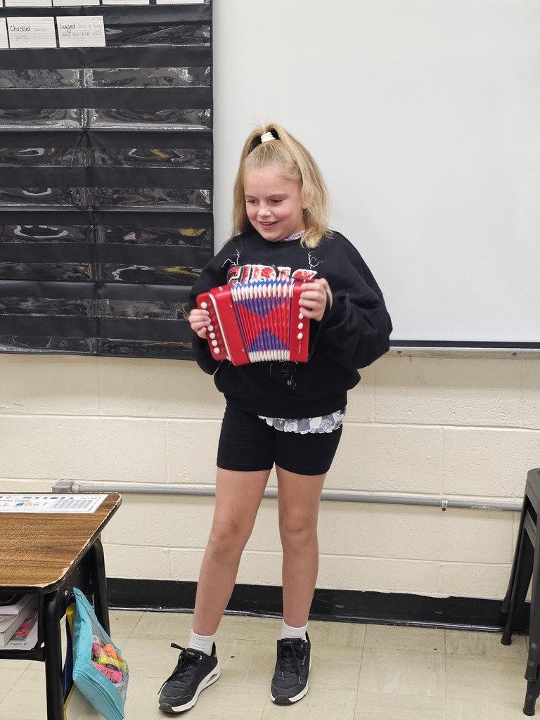 A student is playing the accordian.