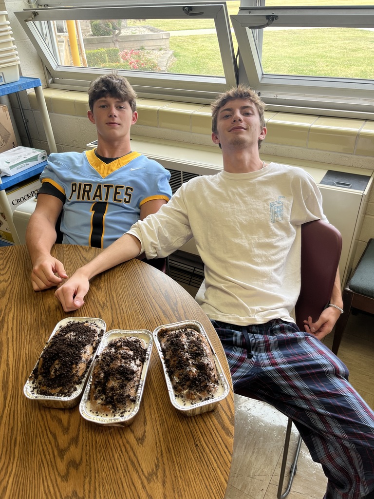 Two students displaying their Oreo banana bread.