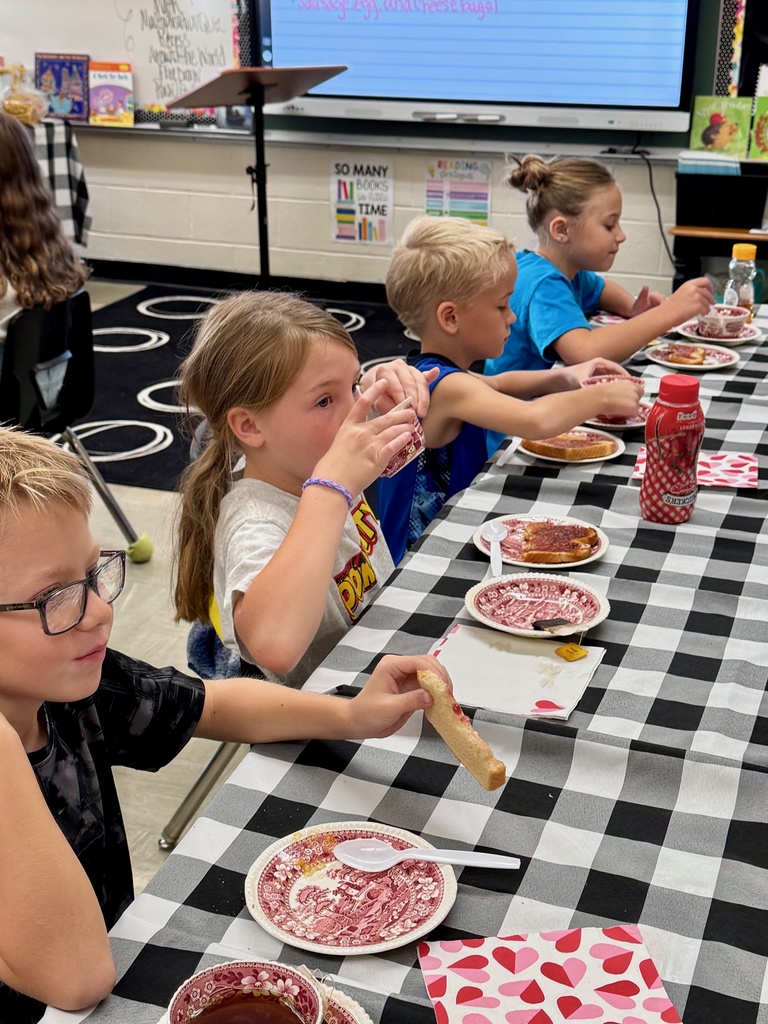 Students are enjoying tea and toast. 