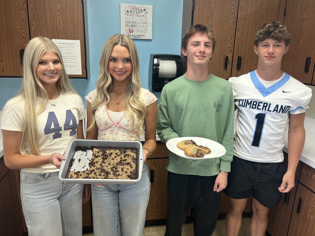 The 4 Foods III students holding their Brookies.