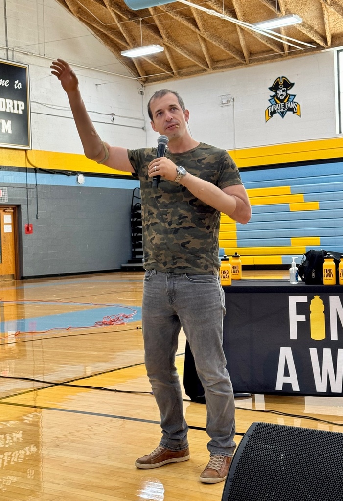 Brad is speaking to the students. 