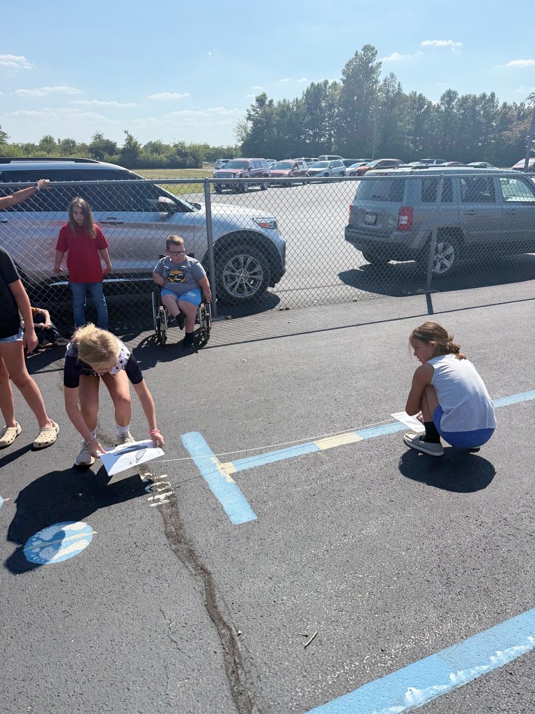 Students are measuring to see if they are faster than a dinosaur. 