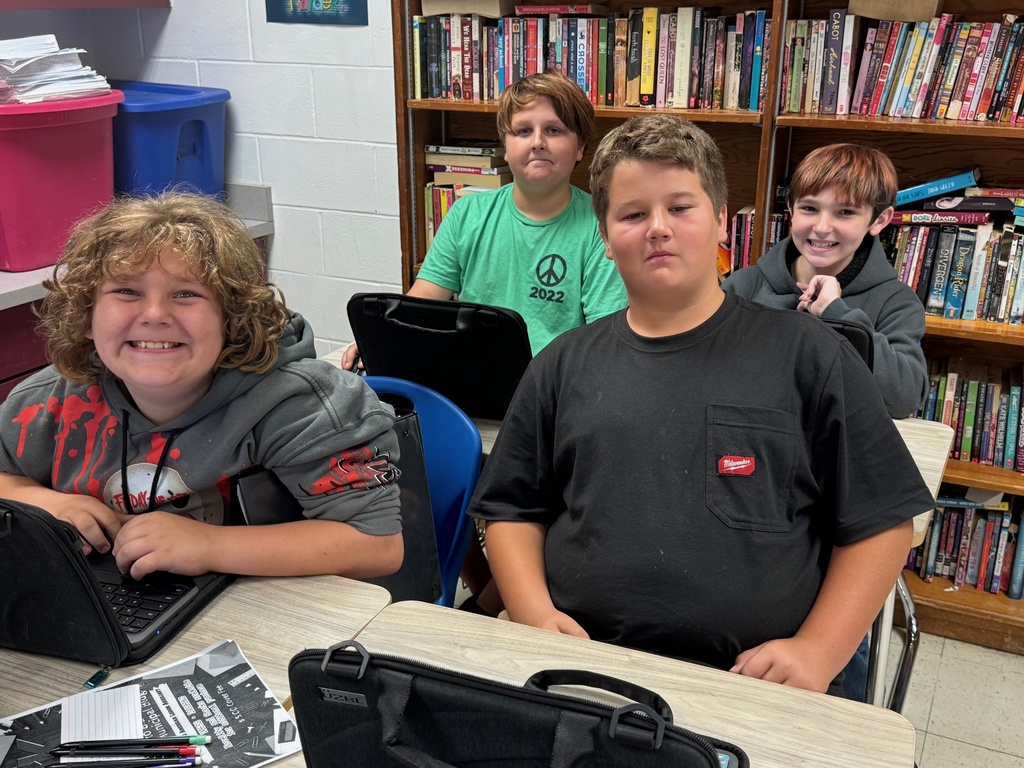 Students are collaborating on an Outsiders Escape Room.